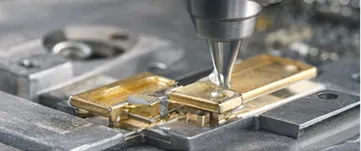 SANCO dispensing machine applying liquid encapsulant over a wire-bonded semiconductor chip package