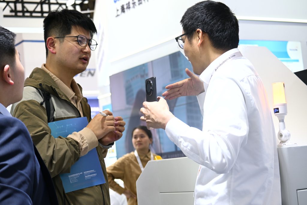 Visitors at SANCO booth during productronica China
